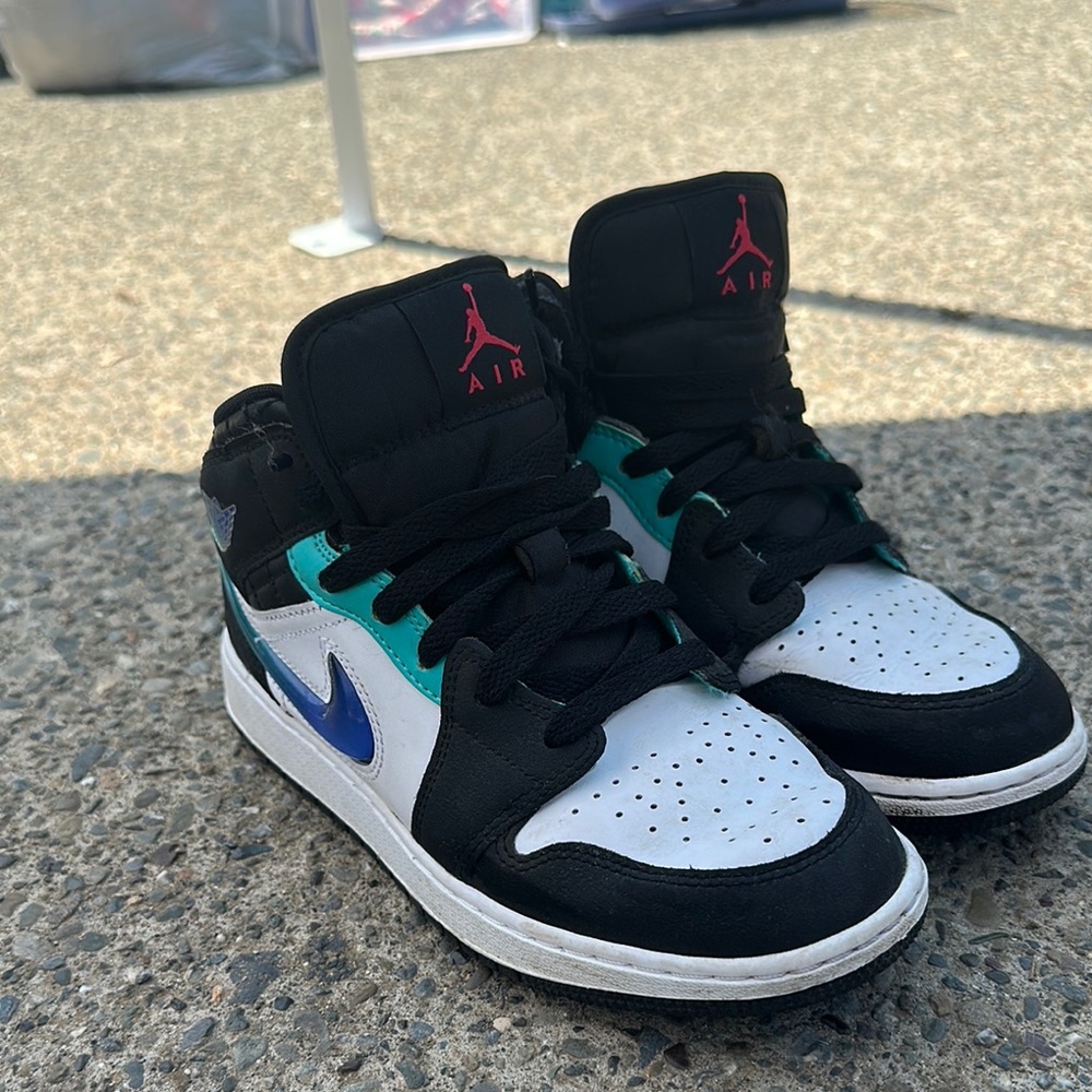 Nike Black and Blue Sneakers with Iconic Design